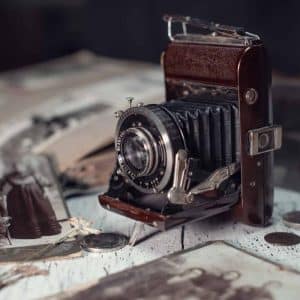 vintage-film-camera-among-old-family-photos-2022-09-14-06-01-03-utc